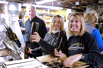 volunteers bottling in cellar